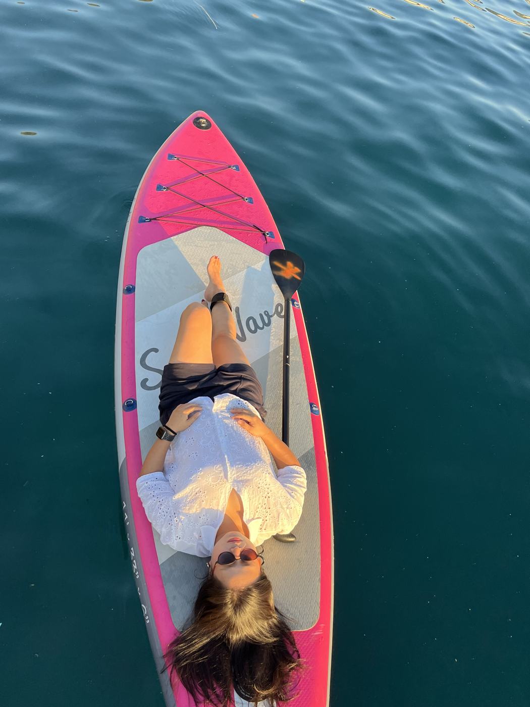 Top-down view of a guest on a pink board