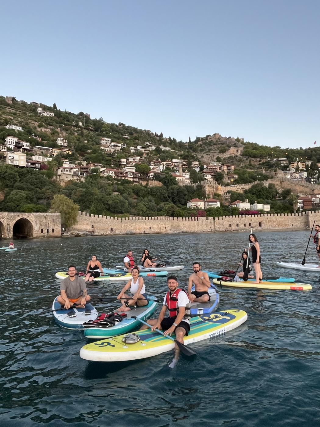 A group of paddlers in front of the Shipyard