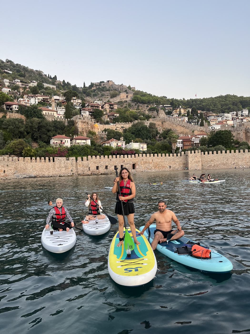 Group of paddlers in front of the Red Tower walls