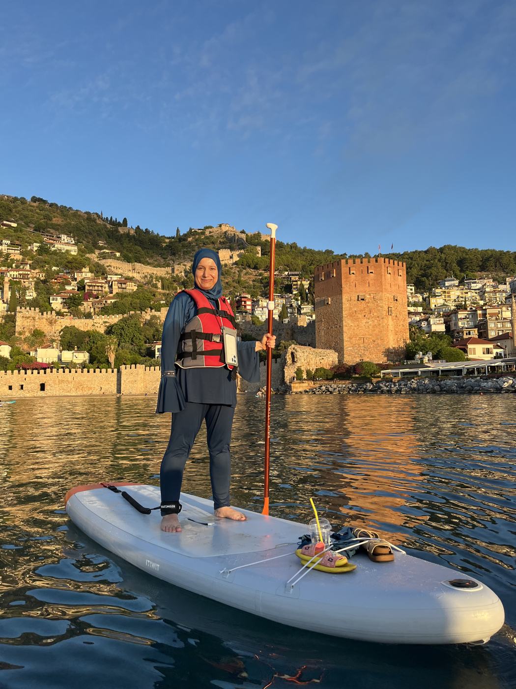 Paddler standing on a board at the Red Tower